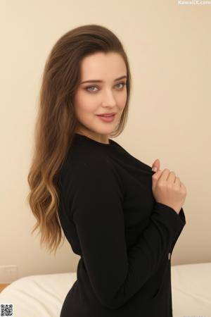 A woman in lingerie posing with her arms crossed.