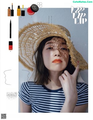 A magazine spread with a woman's face and makeup products.