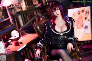 A woman sitting on a chair in a room.